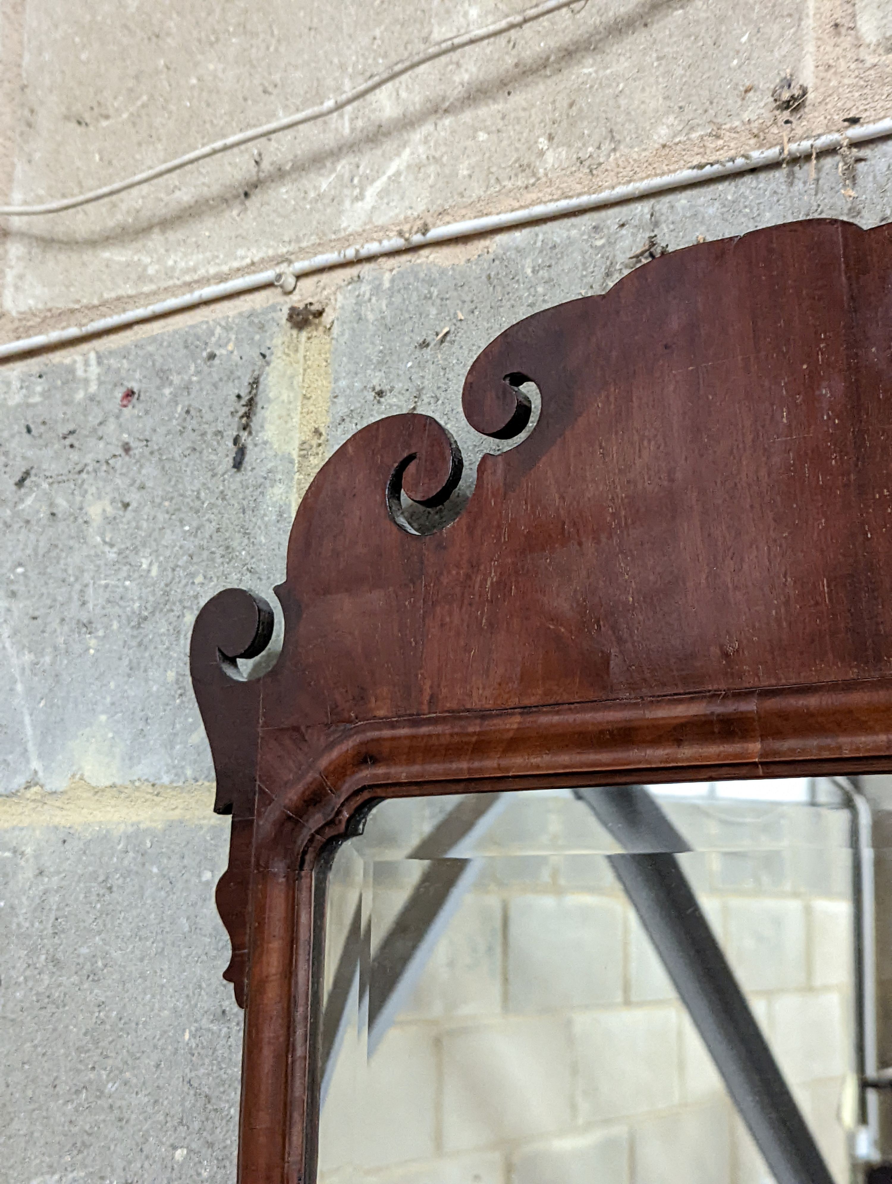 A George II style Fret cut mahogany wall mirror. Length - 86cm, Width - 48cm.